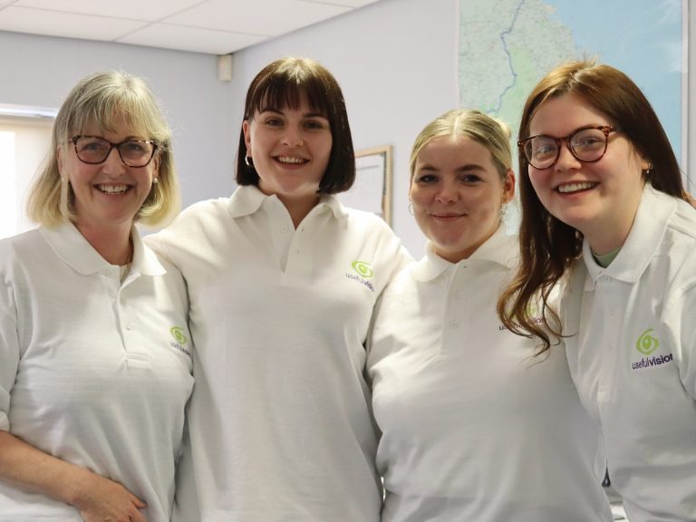 Four members of the Useful Vision Team in white polos.